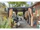 Charming backyard featuring a dining area, grill, string lights, and garden at 4901 N Kenwood Ave, Indianapolis, IN 46208