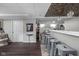 Finished basement with decorative ceiling tiles, and pendant lighting over the bar at 4901 N Kenwood Ave, Indianapolis, IN 46208