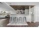 Basement bar area with pendant lighting, decorative ceiling tiles, and gray bar stools at 4901 N Kenwood Ave, Indianapolis, IN 46208