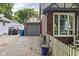 Brick home featuring a driveway, detached garage, and lovely landscaping at 4901 N Kenwood Ave, Indianapolis, IN 46208