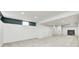 Finished basement area with neutral carpeting and recessed lighting at 5144 N College Ave, Indianapolis, IN 46205