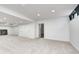 Spacious finished basement features recessed lighting and neutral carpeting at 5144 N College Ave, Indianapolis, IN 46205