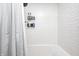 Bathroom with white subway tile, bathtub and shower curtain at 5144 N College Ave, Indianapolis, IN 46205
