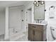 Modern bathroom featuring a walk-in shower, patterned floors, and a wood vanity at 5144 N College Ave, Indianapolis, IN 46205