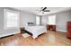 Bedroom with two windows, ceiling fan and hardwood floors at 5144 N College Ave, Indianapolis, IN 46205