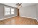 Empty bedroom with ceiling fan, wood floors and a window at 5144 N College Ave, Indianapolis, IN 46205