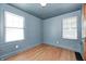 Cozy bedroom with hardwood floors, fresh paint, and double-paned windows offering lots of natural light at 5144 N College Ave, Indianapolis, IN 46205