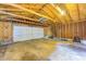 Unfinished garage space with a garage door, a ladder, and some tools at 5144 N College Ave, Indianapolis, IN 46205