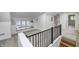 Hallway area featuring a window seat with storage, and a view of the stairs to the level below at 5144 N College Ave, Indianapolis, IN 46205