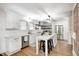 Modern kitchen with white cabinetry, stainless steel appliances, and a stylish island at 5144 N College Ave, Indianapolis, IN 46205