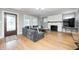 Inviting living room with hardwood floors, fireplace, and abundant natural light at 5144 N College Ave, Indianapolis, IN 46205