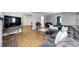 Open-concept living room with hardwood floors, comfortable seating, and stylish decor at 5144 N College Ave, Indianapolis, IN 46205