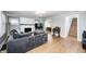 Spacious living room with hardwood floors, fireplace, and staircase access at 5144 N College Ave, Indianapolis, IN 46205