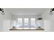 Window seat with pillows and side storage, perfect for relaxing and enjoying the natural light at 5144 N College Ave, Indianapolis, IN 46205