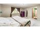 Serene bedroom with a full bed, soft lighting, and an ensuite bathroom entrance for added convenience at 5530 Pilgrim Dr, Indianapolis, IN 46254
