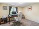 Bright home office featuring a classic desk and modern white ergonomic chair by window offering natural light at 5530 Pilgrim Dr, Indianapolis, IN 46254