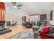 Inviting living room area with hardwood floors, fireplace and an adjacent dining area at 5530 Pilgrim Dr, Indianapolis, IN 46254