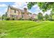 Spacious backyard featuring a well-maintained lawn and established landscaping at 5865 Osage Dr, Carmel, IN 46033