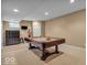 Finished basement with a classic pool table, providing a great entertainment space at 5865 Osage Dr, Carmel, IN 46033