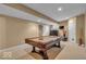 Finished basement featuring pool table, neutral paint, recessed lighting, and dark wood accents at 5865 Osage Dr, Carmel, IN 46033