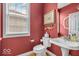 Cozy bathroom featuring vintage accents and hardwood floors and natural light at 5865 Osage Dr, Carmel, IN 46033