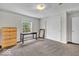 Bright bedroom featuring soft carpet, natural light from window, and light wooden dresser at 5865 Osage Dr, Carmel, IN 46033
