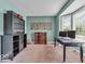 Bright den with neutral carpet, built-in shelving and plenty of natural light at 5865 Osage Dr, Carmel, IN 46033
