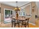 Inviting dining room featuring a decorative chandelier and sliding glass doors to the patio at 5865 Osage Dr, Carmel, IN 46033