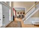 Bright foyer with stairs and view into the dining room at 5865 Osage Dr, Carmel, IN 46033