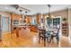Kitchen with stainless steel appliances, light wood cabinets and a cozy breakfast nook at 5865 Osage Dr, Carmel, IN 46033
