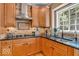 Well-equipped kitchen with stainless steel appliances, granite countertops, and tile backsplash at 5865 Osage Dr, Carmel, IN 46033