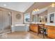 Spacious main bathroom with a whirlpool tub, a shower, and a vanity with lots of counter space at 5865 Osage Dr, Carmel, IN 46033