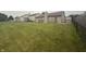 Expansive grassy backyard, perfect for outdoor activities and relaxation with fence and neighbors at 5954 Honeywell Dr, Indianapolis, IN 46236