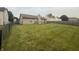 Spacious backyard with a wood fence offering privacy and room for outdoor enjoyment and leisure at 5954 Honeywell Dr, Indianapolis, IN 46236