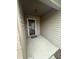 Inviting covered entryway leading to the front door with ample space at 5954 Honeywell Dr, Indianapolis, IN 46236