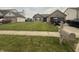 Traditional home featuring a neat lawn and a mailbox, set in a quiet neighborhood at 5954 Honeywell Dr, Indianapolis, IN 46236