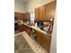 Cozy kitchen featuring wood cabinets, a dishwasher, and a double sink at 5954 Honeywell Dr, Indianapolis, IN 46236