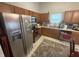 This kitchen features wood cabinets, stainless steel appliances and a double sink at 5954 Honeywell Dr, Indianapolis, IN 46236