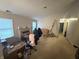 The living room has large windows for natural light and a traditional fireplace at 5954 Honeywell Dr, Indianapolis, IN 46236