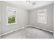 Bedroom featuring neutral walls, carpeted floor, white trim, and a large window with great natural light at 602 W 34Th St, Anderson, IN 46013