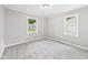 Bright bedroom featuring plush carpet, neutral walls, and large windows, offering natural light at 602 W 34Th St, Anderson, IN 46013