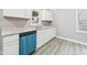 Kitchen view with updated appliances and stylish vinyl flooring at 602 W 34Th St, Anderson, IN 46013