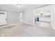 Living room open to kitchen, showing neutral paint and new carpeting at 602 W 34Th St, Anderson, IN 46013