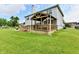 This backyard boasts a beautiful wooden deck with a covered gazebo and a spacious lawn at 6126 Navy Cir, Indianapolis, IN 46221