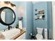 Stylish half-bathroom features modern fixtures, wood countertop, and attractive decor at 6126 Navy Cir, Indianapolis, IN 46221