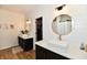 Elegant bathroom with dual sinks, marble countertops, and shiplap walls at 6126 Navy Cir, Indianapolis, IN 46221