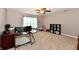 Spacious bedroom offering lots of natural light, a ceiling fan, and neutral walls and carpeting at 6126 Navy Cir, Indianapolis, IN 46221