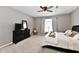 Cozy bedroom with a dark dresser, comfortable bed, and soft natural light at 6126 Navy Cir, Indianapolis, IN 46221