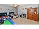 Shared bedroom with two beds, baseball-themed decor, and a wooden dresser at 6126 Navy Cir, Indianapolis, IN 46221
