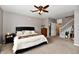 Relaxing bedroom featuring a dark dresser, comfortable bed, and light grey walls at 6126 Navy Cir, Indianapolis, IN 46221